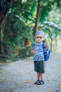 Young boy wearing a hat carries a backpack on his way to Fit Learning for ADHD help in St. Louis