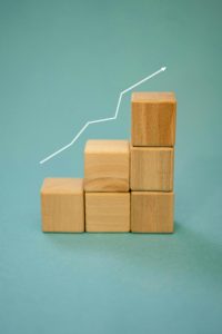 Wooden blocks with an arrow showing upward progression