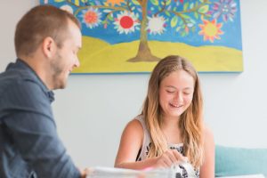 Girl laughing during her precision teaching session at Fit Learning St. Louis