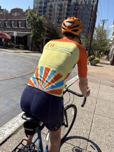 Bike rider wearing a Fit Learning St. Louis shirt 
