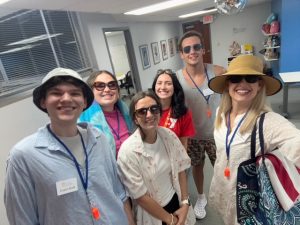 Members of the Fit Learning St. Louis coaching team wearing beach costumes during a Wacky Wednesday at summer camp